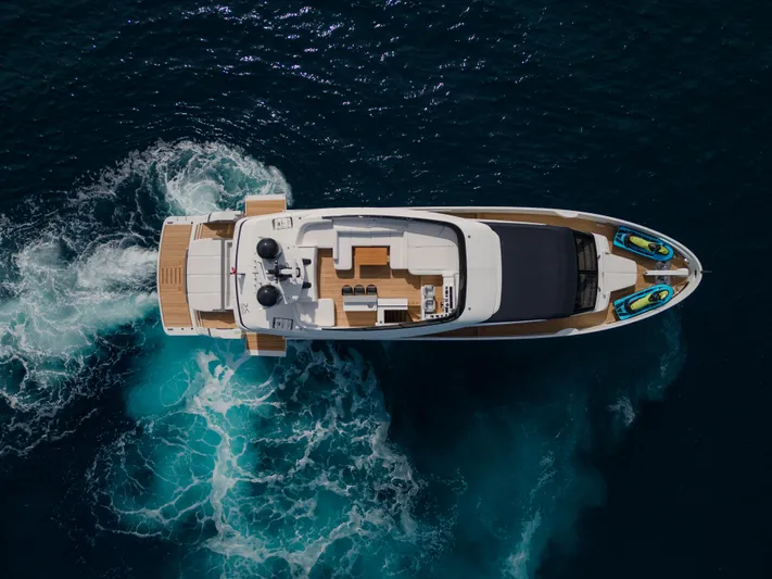 Mini K2 Yacht Photos Pics Aerial view of 2022 Extra X99 FAST yacht cruising in deep blue ocean.