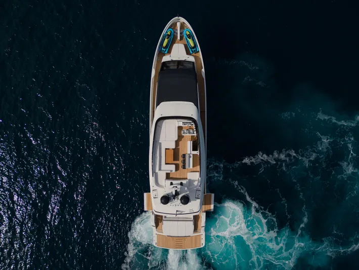 Mini K2 Yacht Photos Pics Aerial view of 2022 Extra X99 FAST yacht cruising on the ocean.