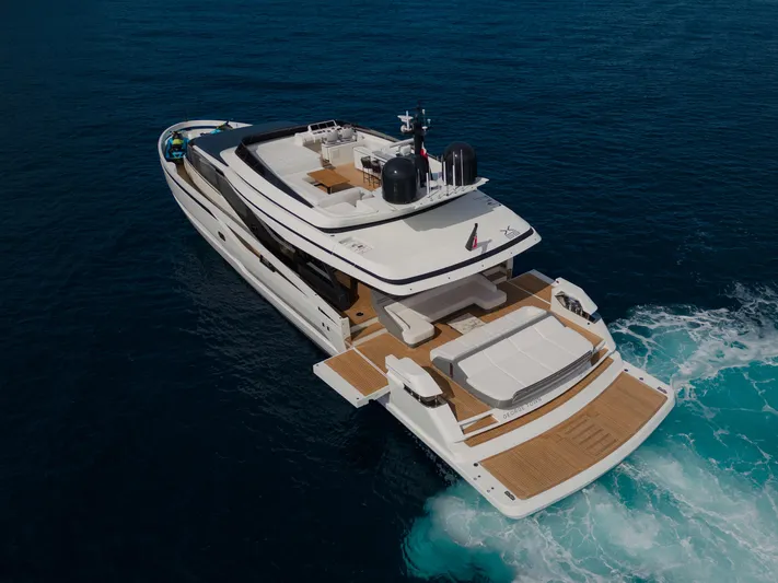 Mini K2 Yacht Photos Pics Luxury yacht Extra X99 FAST 2022 cruising on open sea, aerial view.