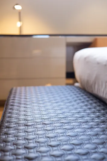 Mini K2 Yacht Photos Pics Modern bedroom with textured bench, sleek dresser, and soft lighting. Extra X99 FAST, 2022.