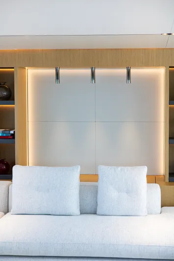 Mini K2 Yacht Photos Pics Modern interior with sleek lighting and minimalist design, featuring a comfortable sofa. Extra X99 FAST 2022.