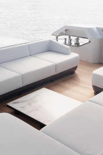 Mini K2 Yacht Photos Pics Luxurious seating area on a 2022 Extra X99 FAST yacht, featuring sleek white cushions.
