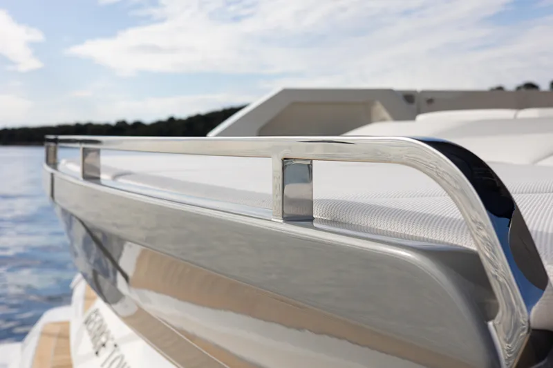 Mini K2 Yacht Photos Pics 2022 Extra X99 FAST yacht railing detail with scenic water backdrop.