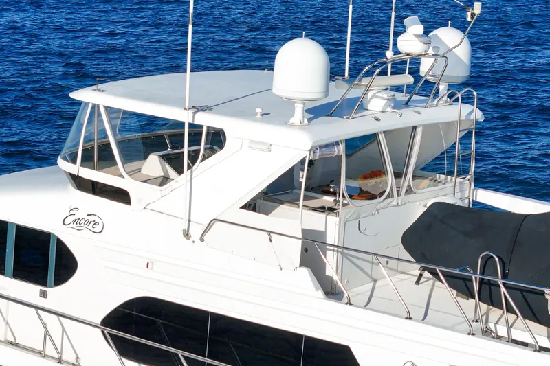 Encore Yacht Photos Pics 2006 Ocean Alexander 64 Pilothouse yacht on blue water, featuring sleek design and modern amenities.