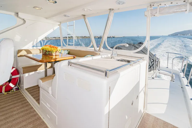 Encore Yacht Photos Pics Luxurious 2006 Ocean Alexander 64 Pilothouse yacht interior with dining area and ocean view.