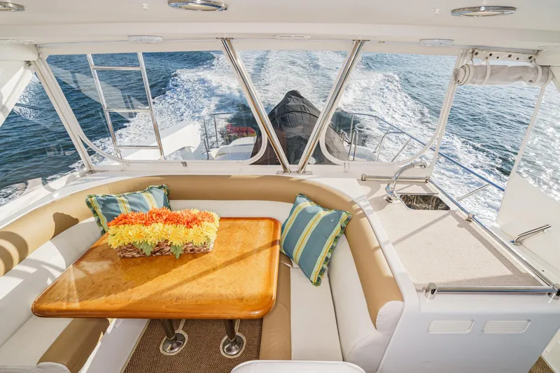 Encore Yacht Photos Pics Luxurious 2006 Ocean Alexander 64 Pilothouse interior with elegant seating and ocean view.