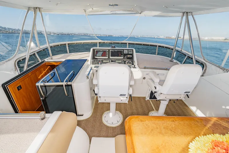 Encore Yacht Photos Pics Pilothouse of 2006 Ocean Alexander 64, featuring dual helm seats and panoramic ocean view.