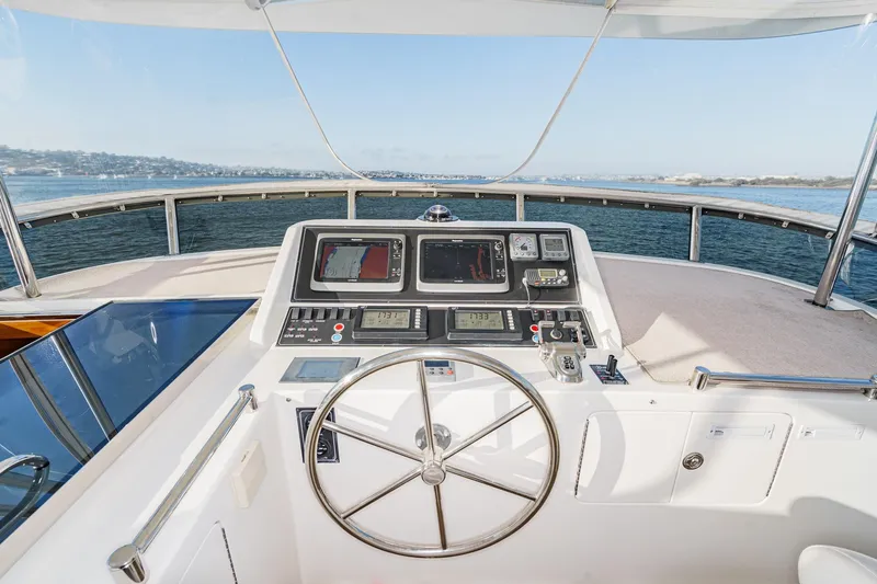 Encore Yacht Photos Pics Pilothouse of 2006 Ocean Alexander 64, featuring navigation controls and ocean view.