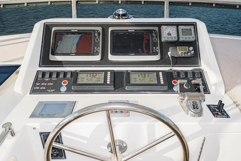 Encore Yacht Photos Pics Pilothouse of 2006 Ocean Alexander 64, featuring navigation controls and dual displays.