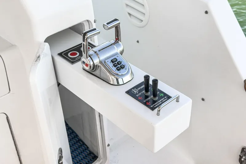 Encore Yacht Photos Pics Control panel of a 2006 Ocean Alexander 64 Pilothouse yacht, featuring throttle and joystick.