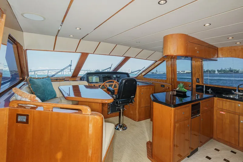 Encore Yacht Photos Pics Luxurious 2006 Ocean Alexander 64 Pilothouse interior with elegant wood finishes and panoramic windows.