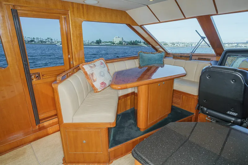 Encore Yacht Photos Pics Luxurious interior of 2006 Ocean Alexander 64 Pilothouse yacht with elegant seating and ocean view.