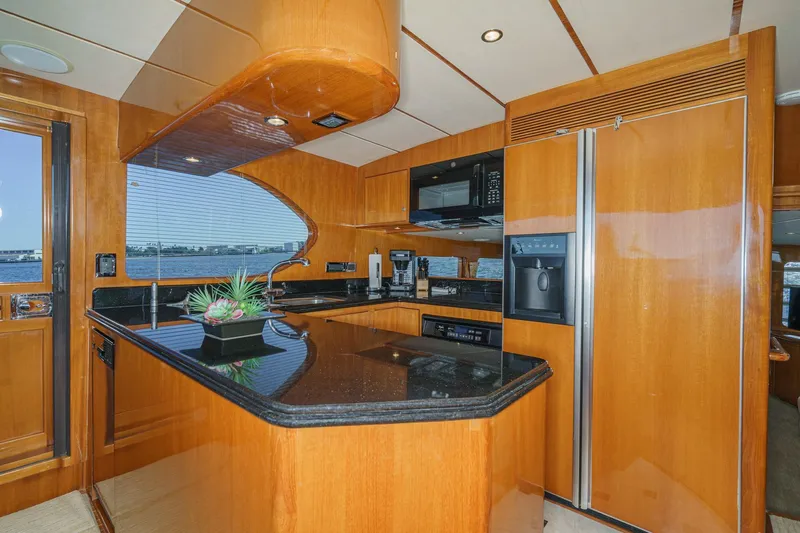 Encore Yacht Photos Pics Luxurious kitchen interior of 2006 Ocean Alexander 64 Pilothouse yacht with modern appliances.