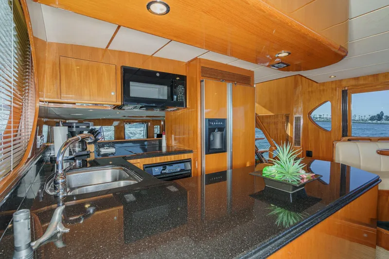 Encore Yacht Photos Pics Luxurious kitchen interior of 2006 Ocean Alexander 64 Pilothouse yacht with modern amenities.