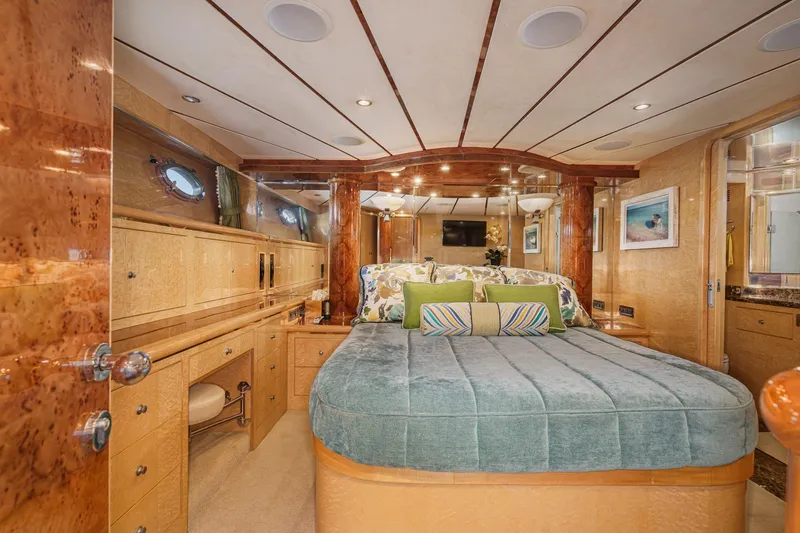 Encore Yacht Photos Pics Luxurious bedroom interior of 2006 Ocean Alexander 64 Pilothouse yacht with elegant wood finishes.