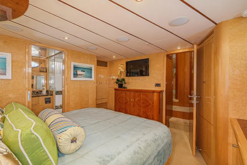 Encore Yacht Photos Pics Luxurious bedroom interior of 2006 Ocean Alexander 64 Pilothouse yacht with elegant wood finishes.