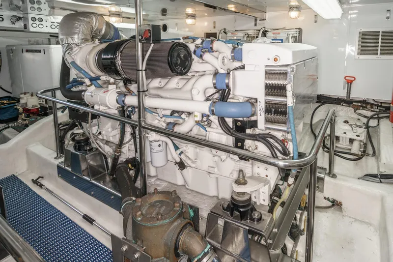 Encore Yacht Photos Pics Engine room of 2006 Ocean Alexander 64 Pilothouse yacht, showcasing detailed machinery and components.