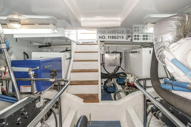 Encore Yacht Photos Pics Engine room of 2006 Ocean Alexander 64 Pilothouse yacht, featuring equipment and storage.