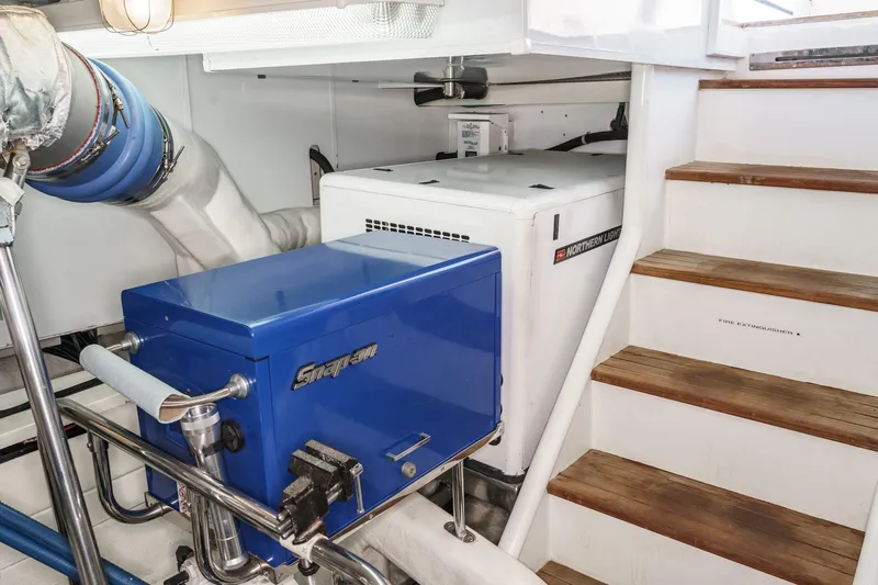 Encore Yacht Photos Pics Engine room of 2006 Ocean Alexander 64 Pilothouse with generator and tool storage.