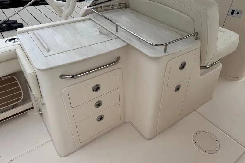  Yacht Photos Pics 2020 Grady-White Freedom 285 boat interior with storage compartments and seating.