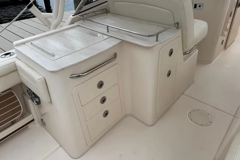  Yacht Photos Pics 2020 Grady-White Freedom 285 boat interior with storage compartments and seating.