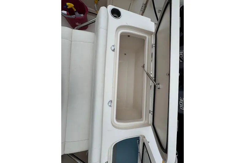  Yacht Photos Pics 2020 Grady-White Freedom 285 boat storage compartment open, showcasing interior space.