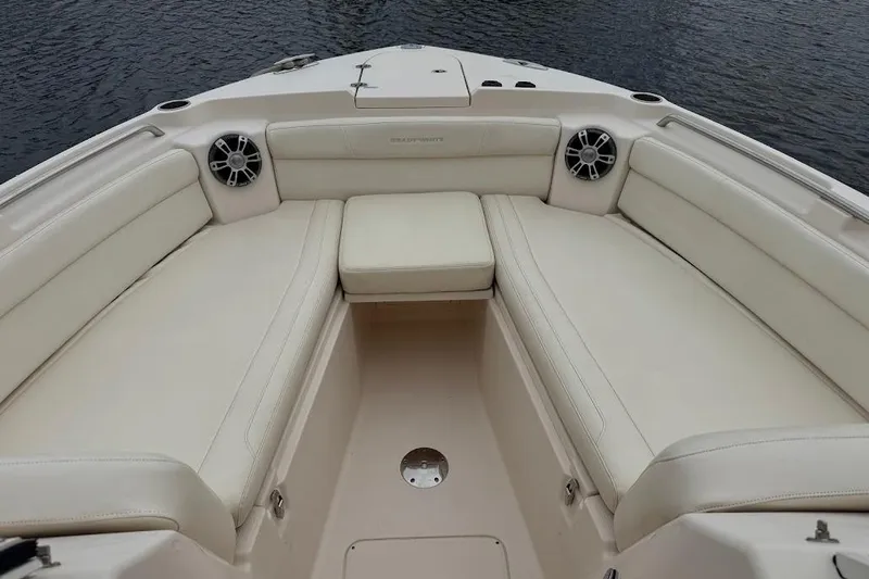  Yacht Photos Pics 2020 Grady-White Freedom 285 boat interior with cushioned seating and speakers.