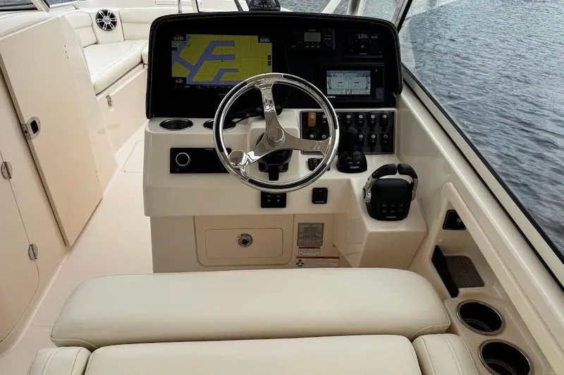  Yacht Photos Pics 2020 Grady-White Freedom 285 boat helm with modern navigation system and controls.