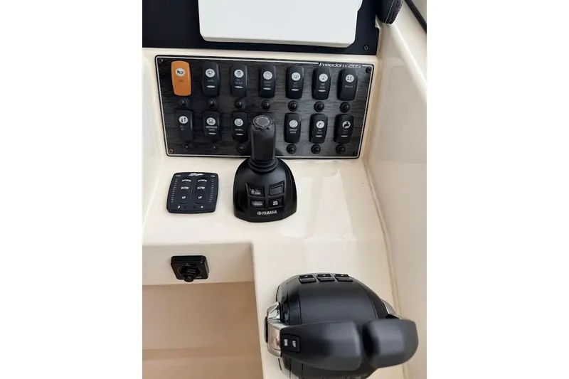  Yacht Photos Pics Control panel of 2020 Grady-White Freedom 285 boat with Yamaha joystick and switches.