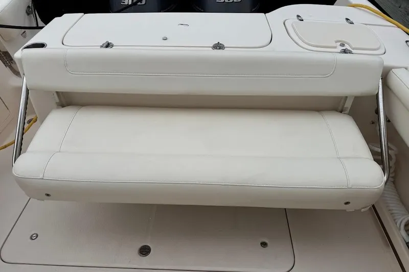  Yacht Photos Pics 2020 Grady-White Freedom 285 boat with white cushioned seating.