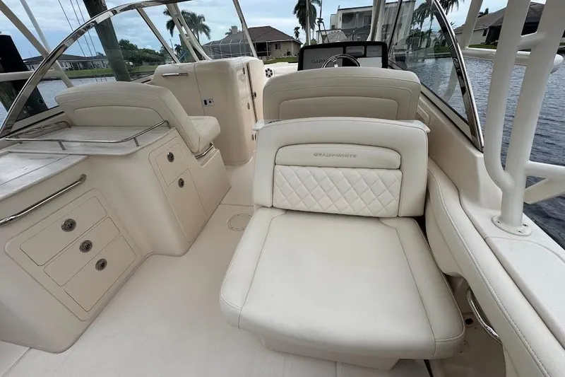  Yacht Photos Pics 2020 Grady-White Freedom 285 boat interior with luxurious seating and storage compartments.