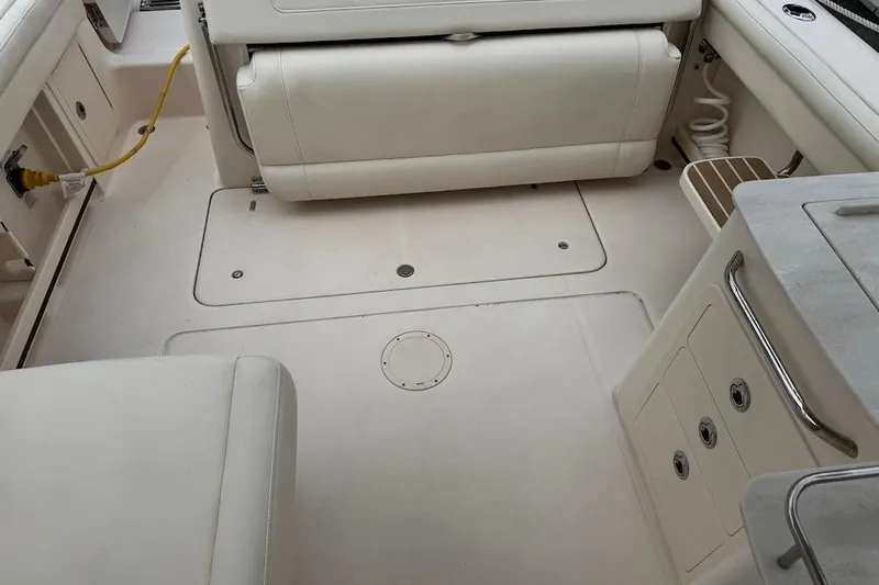  Yacht Photos Pics 2020 Grady-White Freedom 285 boat interior with seating and storage compartments.