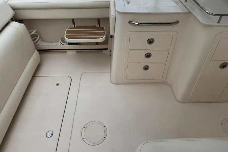 Yacht Photos Pics 2020 Grady-White Freedom 285 boat interior with storage compartments and seating.