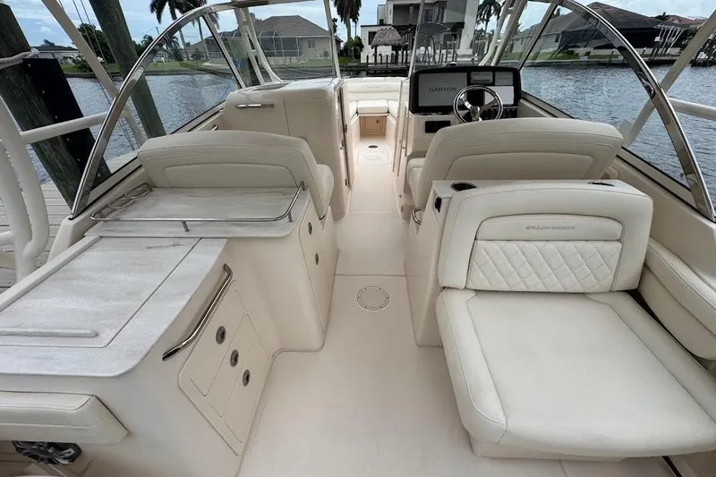  Yacht Photos Pics 2020 Grady-White Freedom 285 boat interior with luxurious seating and steering console.