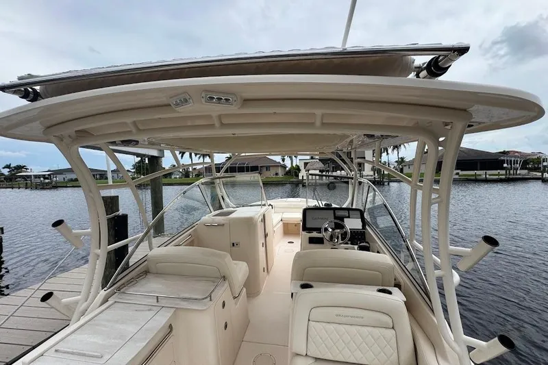  Yacht Photos Pics 2020 Grady-White Freedom 285 boat interior with helm, seating, and water view.