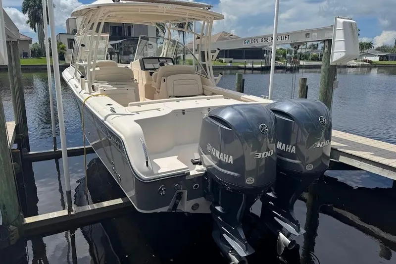  Yacht Photos Pics 2020 Grady-White Freedom 285 boat with twin Yamaha 300 engines docked by waterfront.