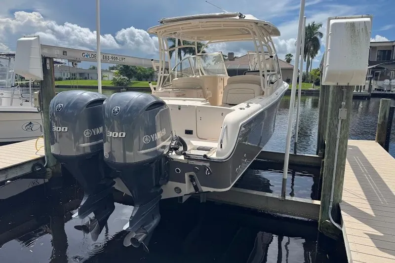  Yacht Photos Pics 2020 Grady-White Freedom 285 boat with twin Yamaha 300 engines docked by waterfront.
