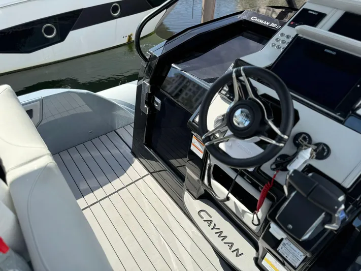  Yacht Photos Pics Cockpit view of 2025 Ranieri CAYMAN 38.0 EXECUTIVE boat with modern steering and controls.