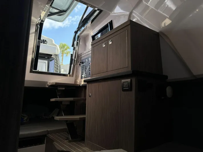  Yacht Photos Pics Interior of 2025 Ranieri CAYMAN 38.0 EXECUTIVE boat with wooden cabinetry and steps.