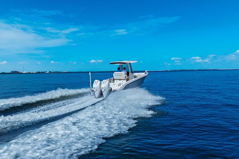 Yacht Photos Pics 2025 Boston Whaler 280 Dauntless cruising on open blue water.