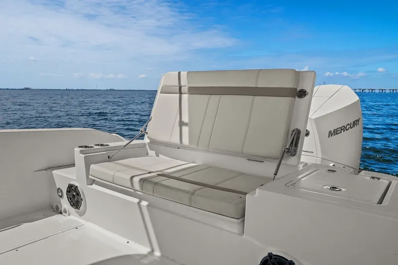  Yacht Photos Pics 2025 Boston Whaler 280 Dauntless boat with comfortable seating and Mercury engine, on open water.