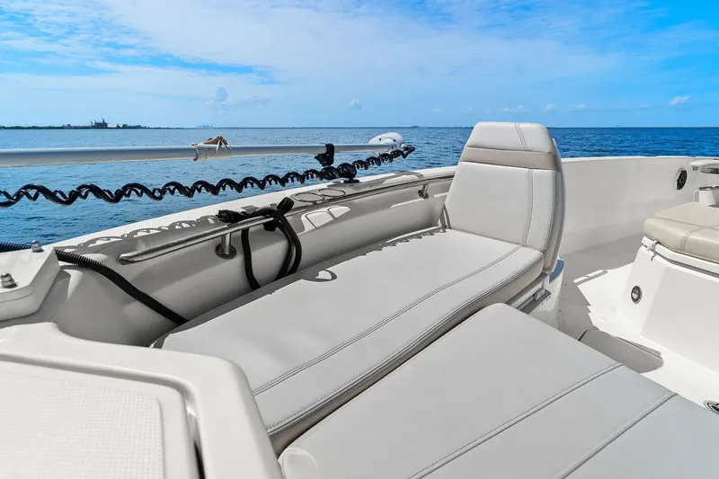  Yacht Photos Pics 2025 Boston Whaler 280 Dauntless boat interior with cushioned seating, ocean view.