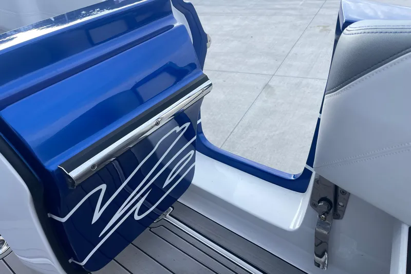 Fresh Water!! Low Hours!! Yacht Photos Pics 2022 Nor-Tech 340 Sport Center Console boat door with sleek blue and white design.
