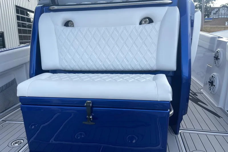 Fresh Water!! Low Hours!! Yacht Photos Pics 2022 Nor-Tech 340 Sport Center Console with white diamond-stitched seating and blue accents.