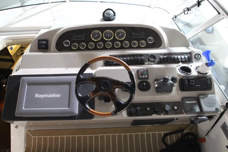  Yacht Photos Pics 2003 Cruisers Yachts 4450 Express Motoryacht helm with Raymarine navigation system.