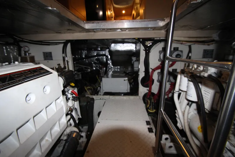  Yacht Photos Pics Engine room of 2003 Cruisers Yachts 4450 Express Motoryacht, showcasing mechanical components.