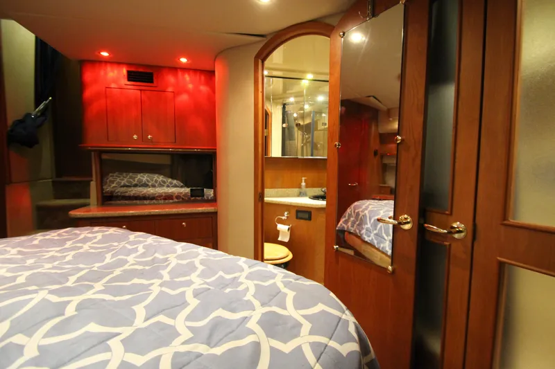  Yacht Photos Pics Luxurious interior of 2003 Cruisers Yachts 4450 Express Motoryacht with elegant wood finishes.