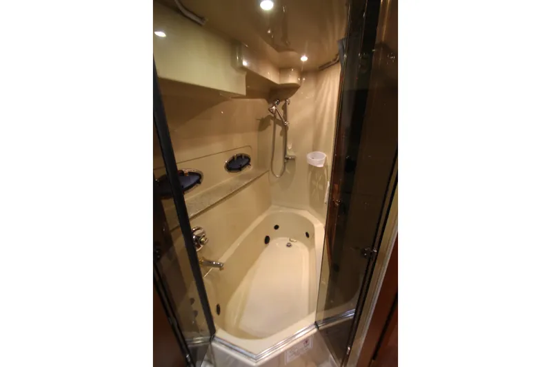  Yacht Photos Pics Luxurious bathroom in 2003 Cruisers Yachts 4450 Express Motoryacht with shower and tub.