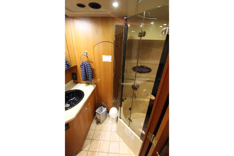  Yacht Photos Pics Luxurious bathroom in 2003 Cruisers Yachts 4450 Express Motoryacht with glass shower.