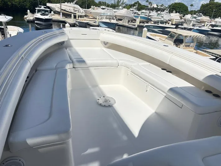  Yacht Photos Pics 2015 Regulator 34 CC boat interior with spacious seating at a marina.